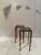 Pair of mid-century modern high aged brass & Smokey glass end tables or plant stands. Great for display.