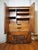 Stylish mid-century modern armoire manufactured by Lane. Intricate design throughout the piece's front. Ample storage...