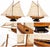Impressive large-scale decorative model of a classic 1930 yacht, beautifully crafted in warm-toned wood with cream fabric...