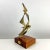 Vintage abstract bronze sculpture mounted on a wood base. Cantilever mounted on the wood base with a bronze plaque with...