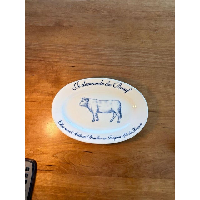 Vintage Williams-Sonoma 'Je Demande du Boeuf' Blue and White Oval Steak Platter. This charming serving piece features a...