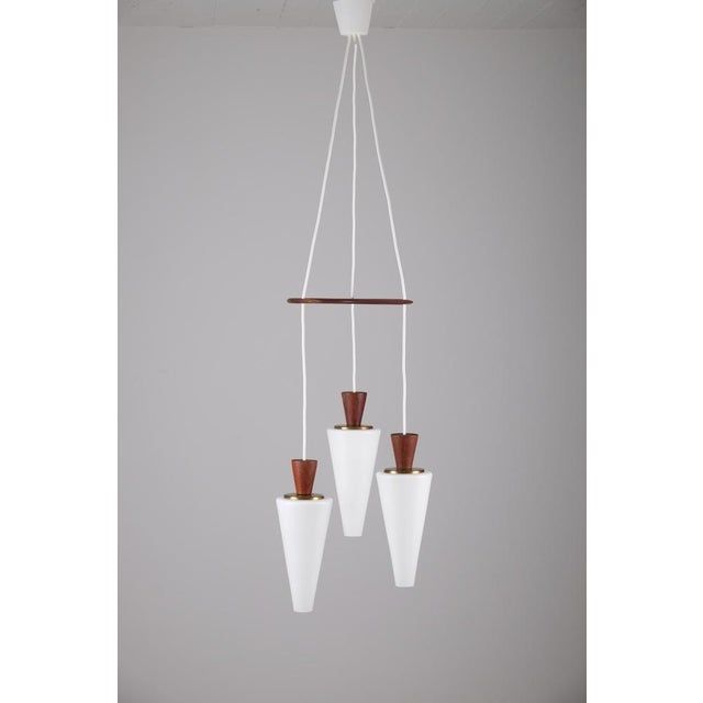 Swedish glass and teak pendant, produced 1950s. Good condition. Diameter: 35 cm Height: 135 cm Up to 250V (Europe/UK...