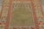 Hand-knotted in wool, this 4x6 Vintage Turkish Anatolian Prayer Rug, circa 1950–1959, features a serene olive mihrab...