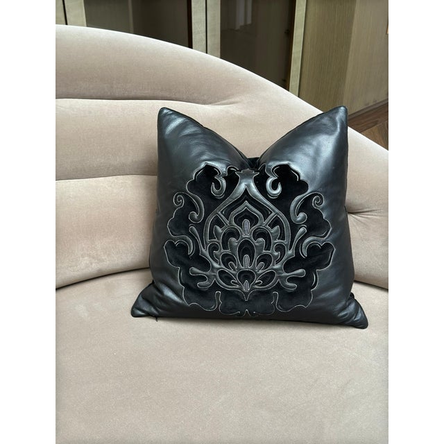 A black leather and suede cushion by Fendi Casa, produced in Italy circa 2011. The front is crafted from fine black...