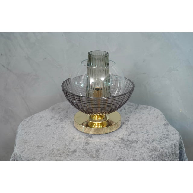 A very special and original Murano table lamps, a series of round glass arranged one on top of the other, in a smoked and...