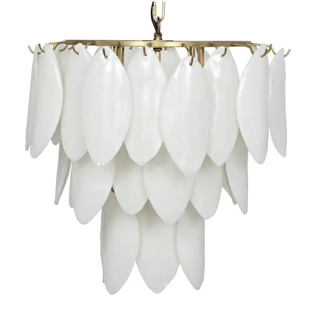 Three tiers of handcrafted glass petals drape the gorgeous Lotus chandelier. For an added touch of luxe, the metal frame...
