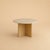 The Hakata is a Roman travertine and oak dining table, a table scaled for a room and its company. Stone and timber are set...