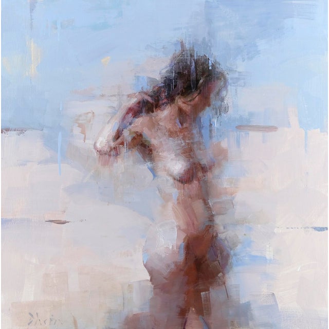 In "Standing Nude with Blue," a figure emerges softly against a backdrop of ethereal blues and muted tones, conveying a...