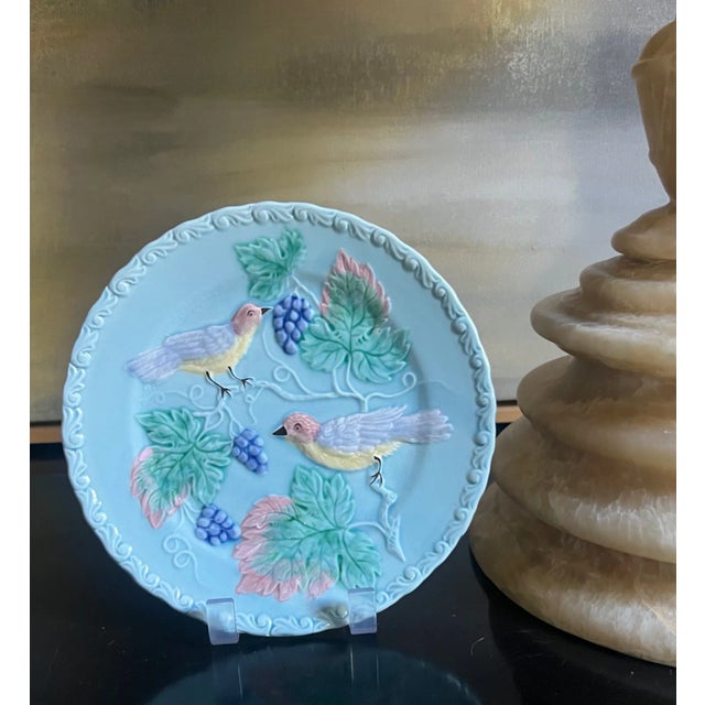 Majolica plate set made in West Germany in the mid 19th century. Light blue with birds eating berries.