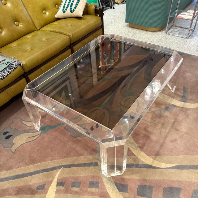 A stunning 1970's rectangular lucite coffee table with smoked glass top, by Les Prismatique (signed). This is a large...