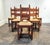 Minimal Mid-Century carved oak Belgian dining chairs with rush seats. Lovely blend of minimal modern design and heavy,...