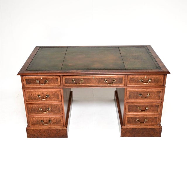 An outstanding antique burr walnut leather top pedestal desk. This was made in England, it dates from around the 1960’s....