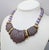 1985 goldtone and purple "sherbet" resin ridged molded 3 plaques with pink "moonglow" beads collar necklace with fold over...