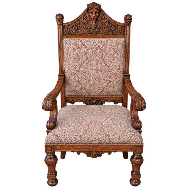 19th Century Oak Renaissance Revival Dining room set includes 6 chairs with lion head details 2 of which are arm chairs.