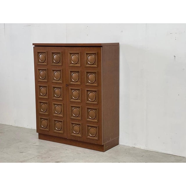 Two tone oak graphical door brutalist (bar) cabinet. Stately piece of furniture which offers plenty of storage space and...