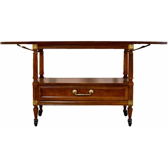 Serve in style with this transitional mid-century bar cart by Thomasville Furniture. Expertly crafted from solid wood,...