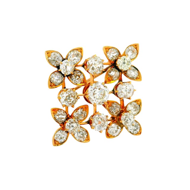 A striking antique brooch from brooch featuring a floral motif with old mine cut diamonds. The diamonds, totaling 4.00...