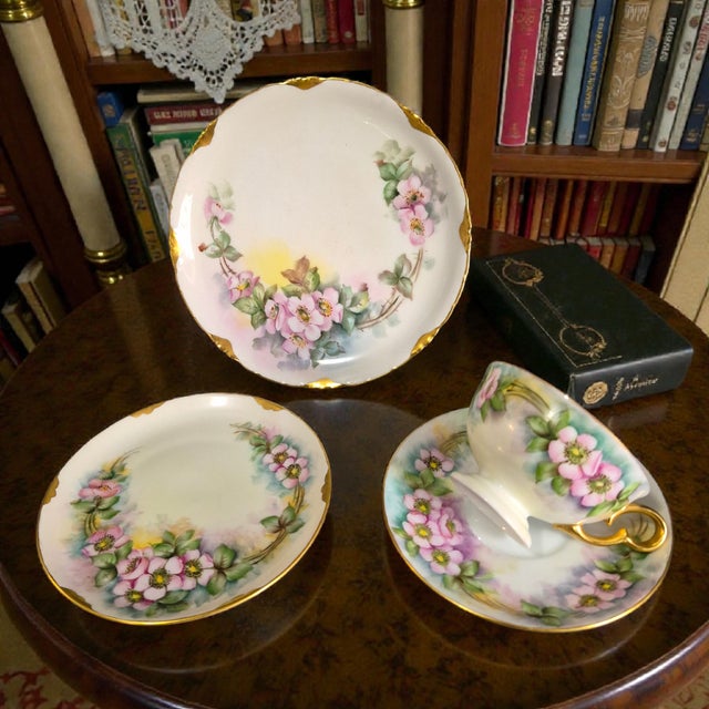 This vintage R.C. Versailles Bavaria porcelain 4-piece tea set features painted pink blossoms in a floral pattern. Made in...