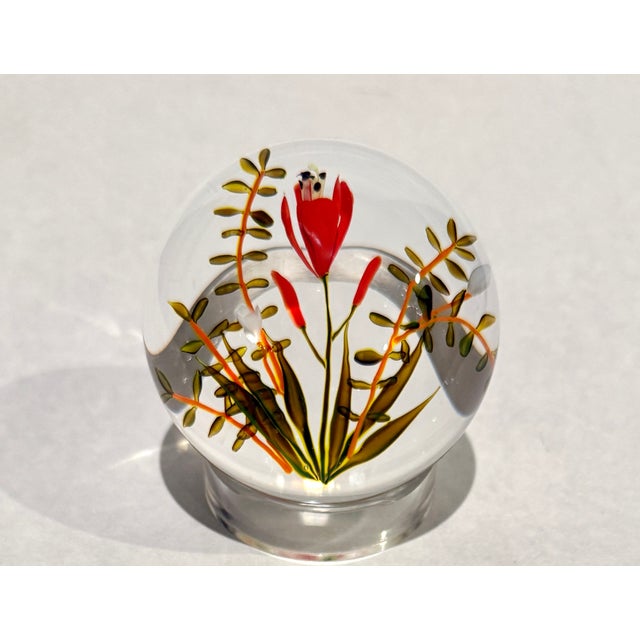 Privately commissioned in 1977, this studio art glass paperweight by Paul Stankard is titled Daylily and features a finely...