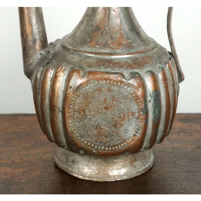 Antique 19th century Middle Eastern Persian tinned copper ewer. Nice decorative hand-hammered ewer in the Mameluke style.