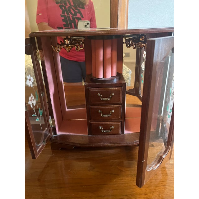 Elevate your vanity, dresser, or nightstand with this charming vintage 1980s–1990s tabletop wooden jewelry box armoire....
