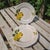 The product is a pair of vintage Opificio Etico Amalfi Coast pattern Italian lemon luncheon plates. These round plates...