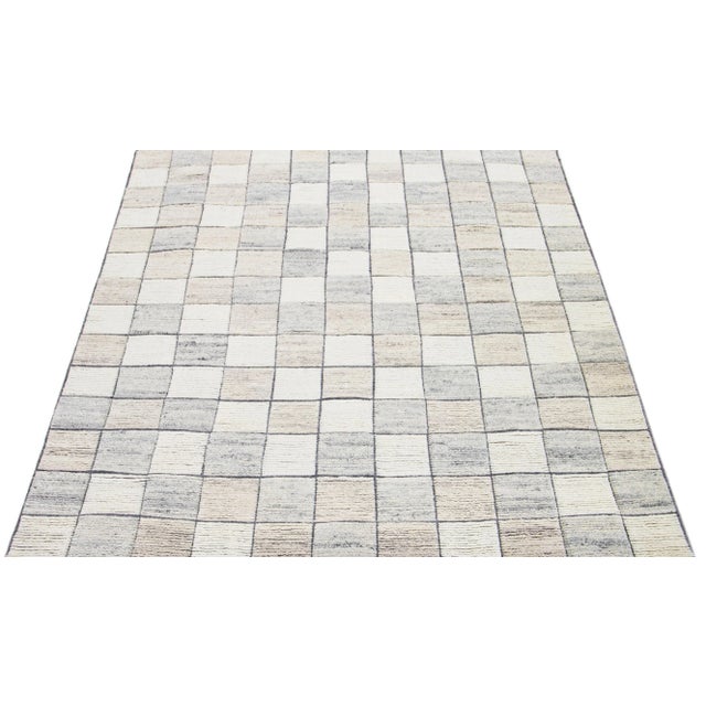 This excellent Modern rug features a subtle background and perfectly complements the carefully handcrafted wool rug...
