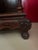 Heavily carved, Chinese rosewood display cabinet with three levels. Base has carved apron and squat legs. Mid-section has...