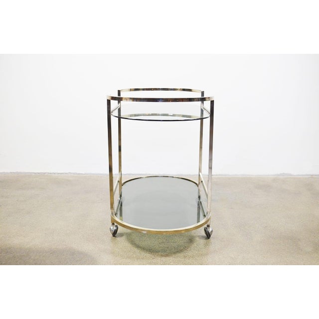 Iconic brass finish and glass bar cart. Sleek styling and solid welded construction. Impeccable quality, weight and...