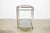 Iconic brass finish and glass bar cart. Sleek styling and solid welded construction. Impeccable quality, weight and...