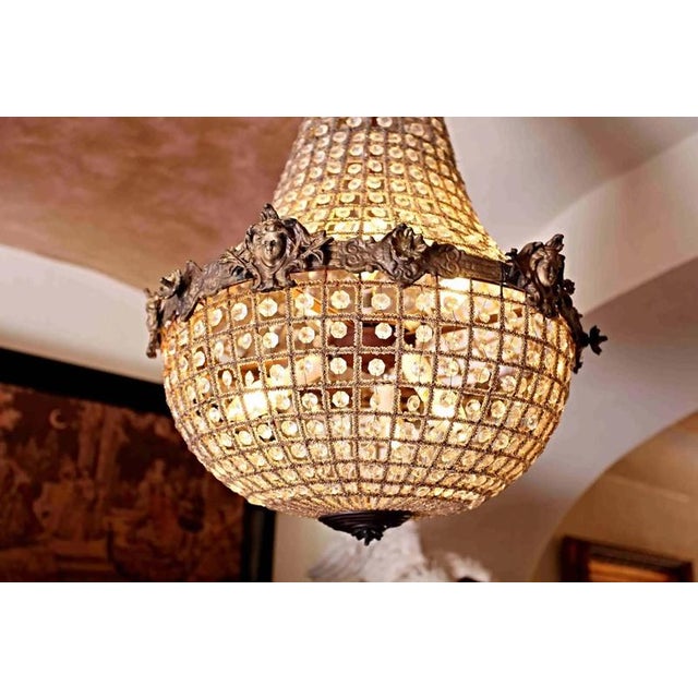 Crystal chandelier in the style of louis xvi with figural decoration. The chandelier is functional - in very good...