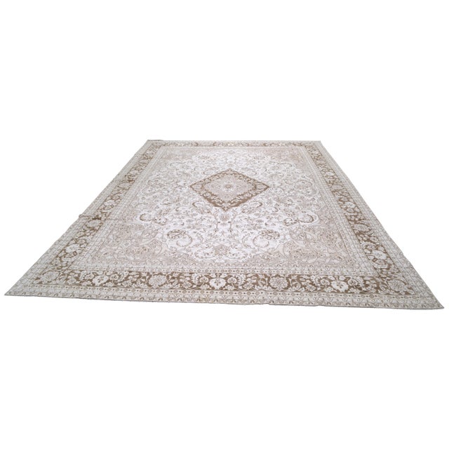 Hand-knotted with care using traditional rug making techniques, this wool rug blends timeless craftsmanship with a modern...