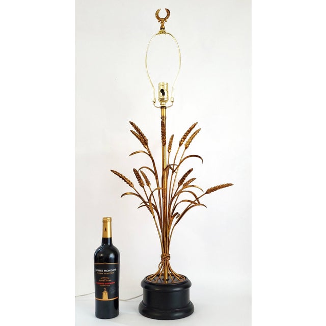 Offering a RESTORED vintage gold leaf wheat sheaf table lamp, circa 1960s. This metal lamp is quite stunning and has great...