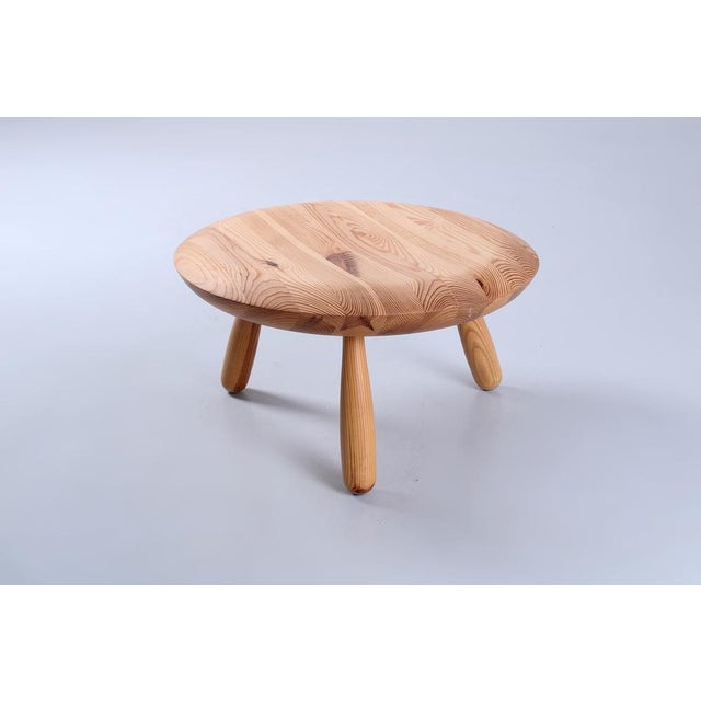 This solid pine wood stool that can double as a side table is clearly an ode to Scandinavian designers from the fifties....