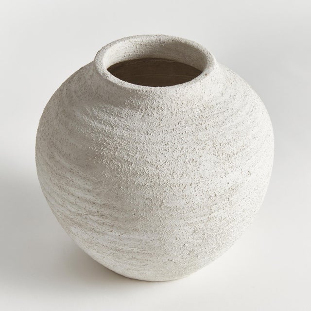 In a textured cold finish, this rotund shaped vase adds a touch of antiquity. Add a few faux stems for color, or display...