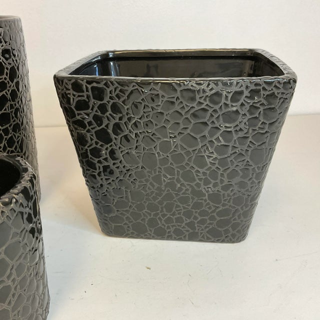 Vintage Home is pleased to offer this vintage set of 3 ceramic planters. Each features an Expresso Brown palette with an...