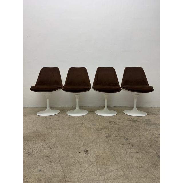 Set of four fully upholstered Tulip Side chairs with white swivel bases by Eero Saarinen for Knoll. These dining or side...
