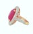 Centering a 23.61 carat natural Burmese ruby, this striking cocktail ring showcases a richly colored cushion-cut gemstone...