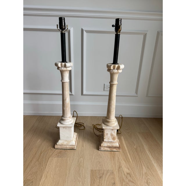 Exceptional Italian hand-carved alabaster column table lamps. Inspired by classical Greek and Roman architecture, each...