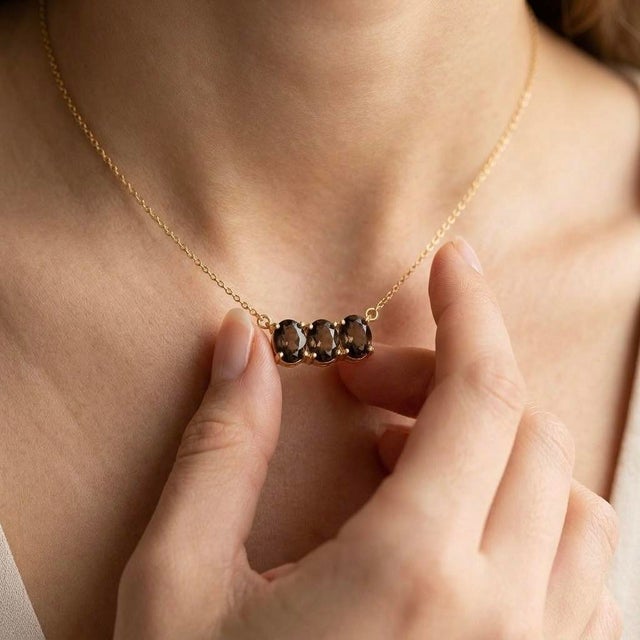 Lend an earthy, modern allure to your jewelry rotation with this three-stone pendant necklace, showcasing two...