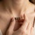 Lend an earthy, modern allure to your jewelry rotation with this three-stone pendant necklace, showcasing two...
