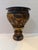 Dramatic vintage ceramic jardinière planter featuring ornate figural and scrolling relief decoration with a richly layered...