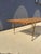 Designed by Hugh Acton, this elegant slatted bench is a striking example of modernist furniture, combining clean...
