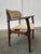 This set of ten modern Danish dining chairs is attributed to the renowned designer Erik Buch. with their gracefully curved...