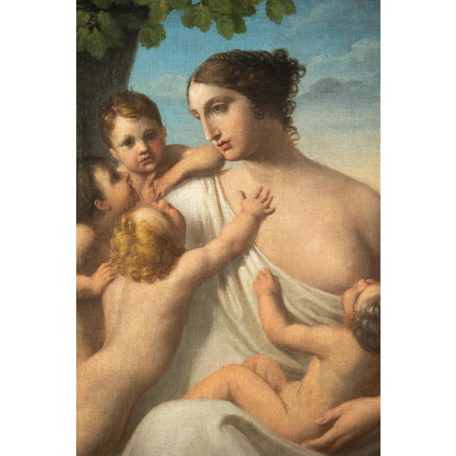 Oil on canvas depicting an allegory of charity from the 18th century. This Italian neoclassical painting emphasizes a...