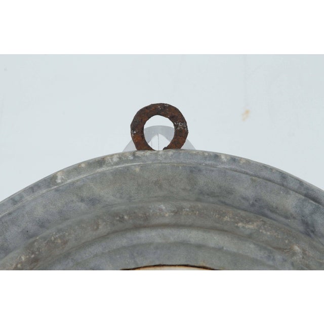 Wonderful, Carrara marble relief portrait of a Cardinal in vestments, set in a 19th century, gray marble surround.