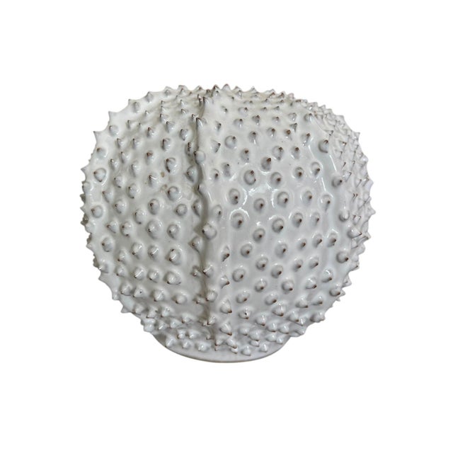 Embrace a touch of organic coastal elegance with this striking vintage ceramic bud vase, thoughtfully designed to mimic...