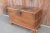 Originally a Dowry chest made from teak wood, stands on wooden caster legs, iron side handles and nail head details, it...