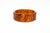 This vintage Art Deco carved bakelite bangle carved bracelet has beautiful tonal ranges of colors of orange amber, caramel...