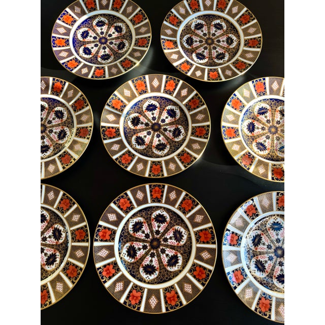 A distinguished example of traditional English porcelain, this Royal Crown Derby Old Imari Pattern 1128 dinner plate is...